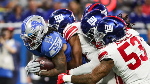 Detroit Lions tight end Sam LaPorta (87) makes a pass against New York Giants safety Jason Pinnock (27) during the first half of a preseason at Ford Field in Detroit on Friday, Aug. 11, 2023.